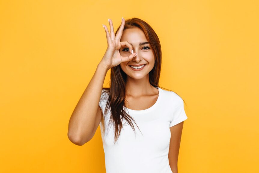 young woman making OK sign